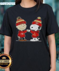 Alt Text: Charlie Brown and Snoopy fist bump in San Francisco 49ers football ladies tee, perfect for Peanuts fans.