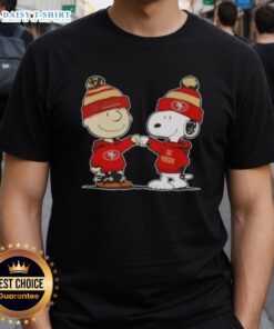 Top Peanuts Charlie Brown fist bump with Snoopy on a San Francisco 49ers football T-shirt, perfect for fans.