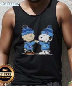 Alt Text: Charlie Brown and Snoopy fist bump on a Tennessee Titans football tank top featuring Peanuts characters.