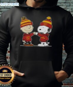 Alt Text: Charlie Brown and Snoopy fist bump in a Washington Commanders football hoodie, celebrating Peanuts fandom.