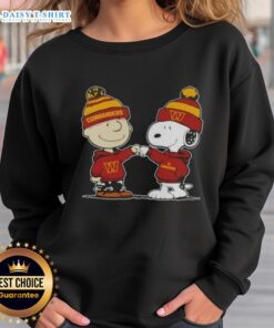 Charlie Brown fist bumping Snoopy in Washington Commanders football sweatshirt, perfect for Peanuts fans.