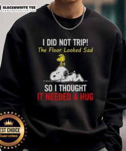 Cozy sweatshirt featuring Snoopy and Woodstock with the quote 'I did not trip, the floor looked sad, so I thought it needed a hug.'
