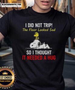 Alt Text: Top Peanuts Snoopy and Woodstock T-shirt featuring humorous quote about not tripping and hugging the floor.