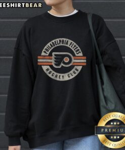Vintage Philadelphia Flyers sweatshirt featuring bold team colors and logo, perfect for hockey fans and collectors.