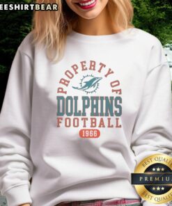 Miami Dolphins sweatshirt featuring top property design, celebrating the team's legacy since 1966.