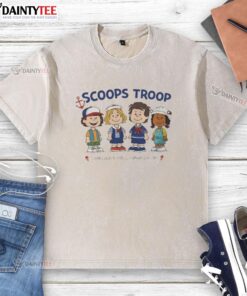 Alt Text: Top Scoops Troop Starcourt Mall Hawkins washed t-shirt featuring Stranger Things x Peanut cartoon design.