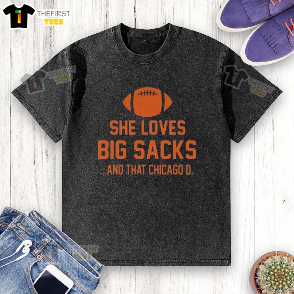 top-she-loves-big-sacks-and-that-chicago-d-washed-t-shirt Alt Text: Woman wearing a Chicago D washed t-shirt, showcasing her love for big sacks at a trendy urban location.