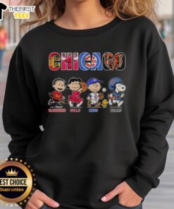 Cozy sweatshirt featuring Snoopy and Charlie Brown with Chicago Blackhawks, Bulls, Cubs, and Bears logos.