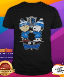 Alt Text: Snoopy giving a high five to Charlie Brown, both wearing a Dallas Mavericks T-shirt, celebrating teamwork and fun.