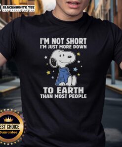 Alt Text: Top Snoopy 'I'm Not Short I'm Just More Down To Earth Than Most People' T-Shirt design featuring Snoopy illustration.