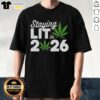 Top Staying Lit In 2026 Marijuana Meme T-Shirt featuring a humorous cannabis graphic and bold text design.
