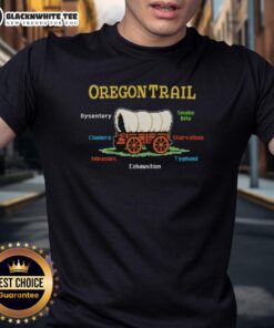 Top The Oregon Trail T-Shirt featuring humorous references to dysentery, snake bites, cholera, and starvation.