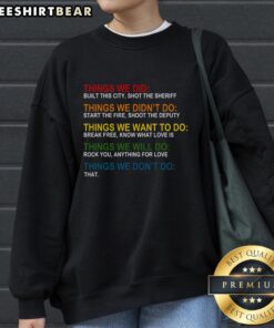 Cozy 'Top Things We Didn't Want, Will, Won't Do' sweatshirt displayed on a hanger, perfect for casual wear.