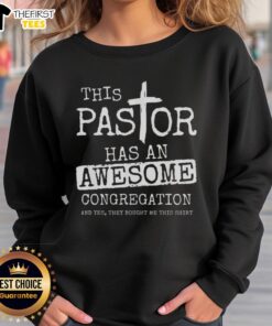 Alt Text: Pastor wearing 'Top This' sweatshirt with a vibrant congregation in a lively church setting.
