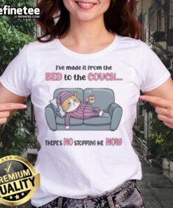 Top tired cat lounging on couch after a triumphant journey from the bed, showcasing its playful personality. Ladies tee design.