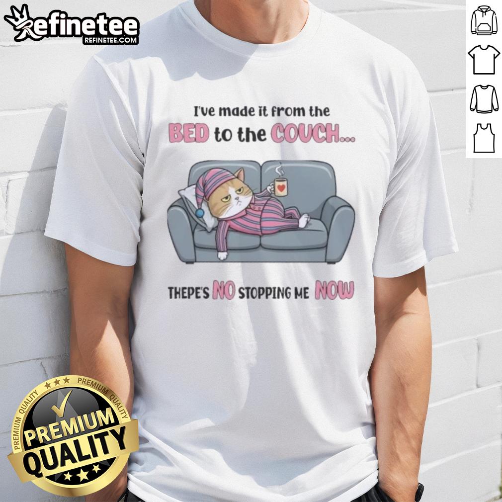 top-tired-cat-ive-made-it-from-the-bed-to-the-couch-thepes-no-stopping-me-now-t-shirt Top tired cat wearing 'I've made it from the bed to the couch, there's no stopping me now' T-shirt, lounging comfortably.