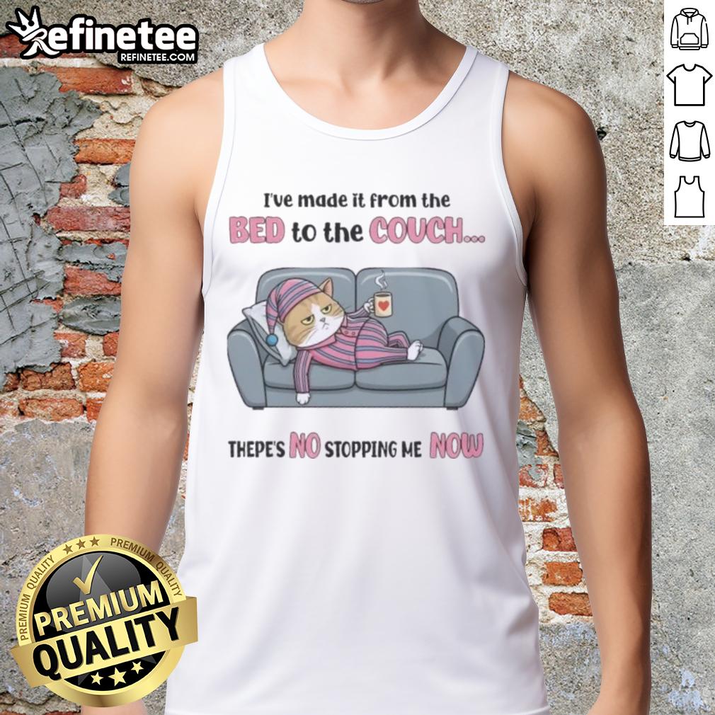 top-tired-cat-ive-made-it-from-the-bed-to-the-couch-thepes-no-stopping-me-now-tank-top Top tired cat relaxing on a couch after moving from the bed, showcasing its playful spirit in a tank top.