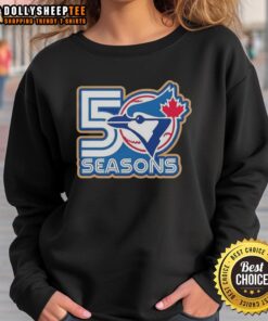 Alt Text: Top Toronto Blue Jays 50 Seasons logo sweatshirt featuring a stylish design for fans of the MLB team.