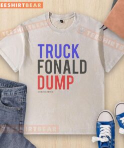 Top Truck Fonald Dump God Bless America washed t-shirt design featuring patriotic graphics and bold lettering.