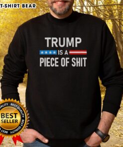 Top Trump Is A Piece Of Shit sweatshirt displayed on a hanger, featuring bold text and a casual design.