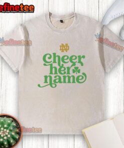 Alt Text: Notre Dame Cheer Her Name logo on a washed t-shirt, showcasing school spirit and pride for the University of Notre Dame.