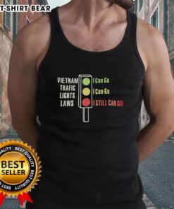 Alt Text: Top Vietnam traffic lights laws illustrated on a tank top: green means go, yellow means go, red means go.
