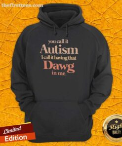 Person wearing 'Top You Call It Autism I Call It Having That Dawg In Me' hoodie, showcasing unique style and personality.