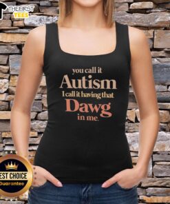 Person wearing a 'Top You Call It Autism I Call It Having That Dawg In Me' tank top, showcasing pride and individuality.