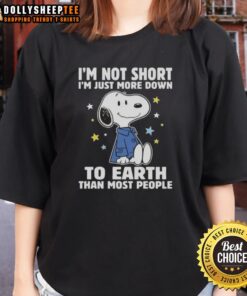 Alt Text: Snoopy graphic tee for women with 'I'm not short, I'm just more down to earth than most people' slogan.