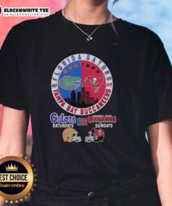 Alt Text: Florida Gators and Tampa Bay Buccaneers helmet logo mashup on a ladies tee, perfect for game day fans.