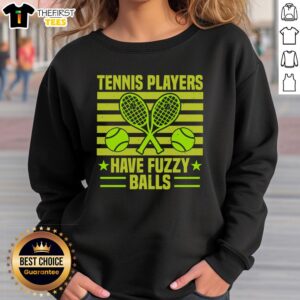 Funny tennis player wearing a fuzzy balls sweatshirt, showcasing a playful and humorous sports style on the court.