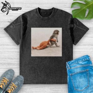 Adorable Punch the Monkey plush toy alongside a washed t-shirt featuring a cute design, perfect for kids.