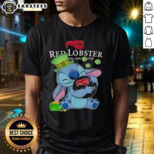 Alt Text: Cute Stitch hugging a red lobster logo on a Happy Patrick's Day T-shirt design, perfect for celebrating the holiday.