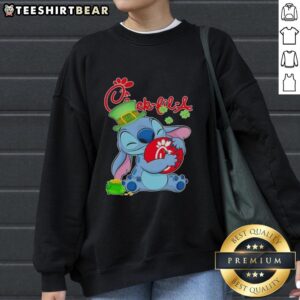 Alt Text: Cute Stitch sweatshirt featuring St. Patrick's Day design and Chick-fil-A logo, perfect for festive wear.