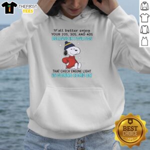Alt Text: Cozy hoodie featuring Snoopy and a fun message about enjoying your 20s to 40s before the 50s check engine light.