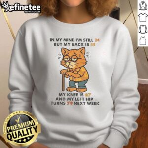 Funny cat sweatshirt design: 'In my mind I'm still 24, but my back is 55' showcasing humor about aging.