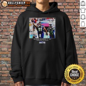 Byron Murphy II in a Seattle Seahawks hoodie during NFL 2026 game, showcasing team spirit and style.