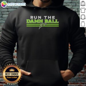 Kenneth Walker III in Seattle Seahawks 'Run The Damn Ball' signature hoodie, showcasing team spirit and style.