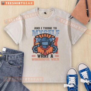 Alt Text: Top And I Think To Myself What A Wonderful Weld Washed T-Shirt in a vibrant color, showcasing a relaxed fit and unique design.