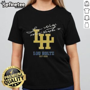 Alt Text: Ladies tee featuring Lou Holtz's signature and National Championships, honoring his legacy from 1937 to 2026.