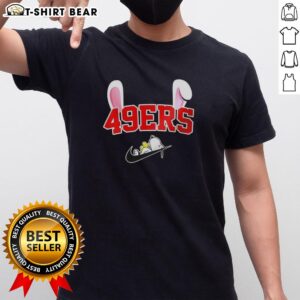 Pretty San Francisco 49ers X Snoopy Happy Easter T-Shirt featuring colorful graphics of Snoopy and festive Easter elements.