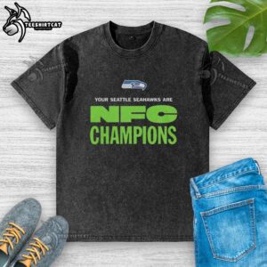 Alt Text: Original Seattle Seahawks NFC Champions logo on a washed t-shirt, perfect for fans celebrating the team's victory.