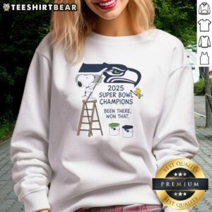 Alt Text: Snoopy and Woodstock drawing on a Seattle Seahawks sweatshirt celebrating 2025 Super Bowl Champions.