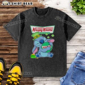 Happy St. Patrick's Day washed t-shirt featuring a cute stitch hugging the Krispy Kreme logo in vibrant colors.
