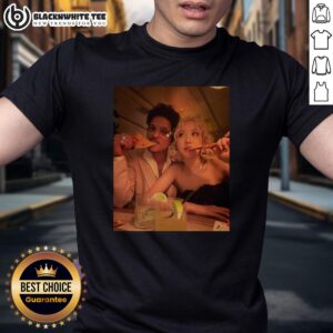 Nice Bruno Mars and Rose enjoying pizza while wearing a 2026 Grammy T-shirt, capturing a fun moment together.