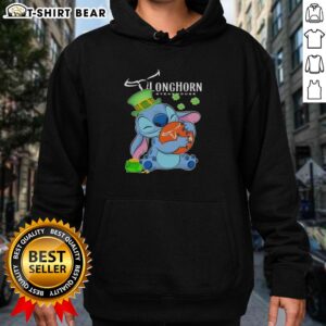 Alt Text: Pretty Stitch Hug Texas Longhorn Steakhouse logo on a Happy St. Patrick's Day hoodie, perfect for festive celebrations.