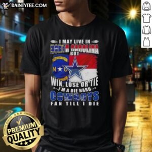 Funny Dallas Cowboys fan t-shirt design with football flag, showcasing pride despite living in North Carolina.