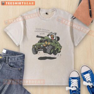 Alt Text: Funny graphic washed t-shirt featuring a raccoon driving a tank, perfect for casual wear and government work humor.