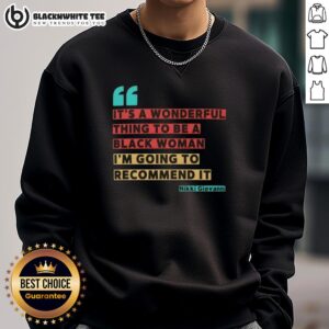 Alt Text: Black woman wearing 'It's A Wonderful Thing To Be A Black Woman' sweatshirt by Nikki Giovanni, celebrating empowerment.