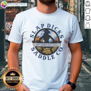 Alt Text: Premium Ain't Gonna Ride Itself Slap Dicks Saddle Co logo t-shirt featuring a bold graphic design and vibrant colors.